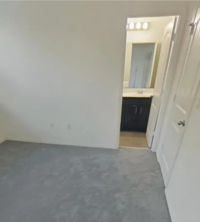 a view of hallway with sink