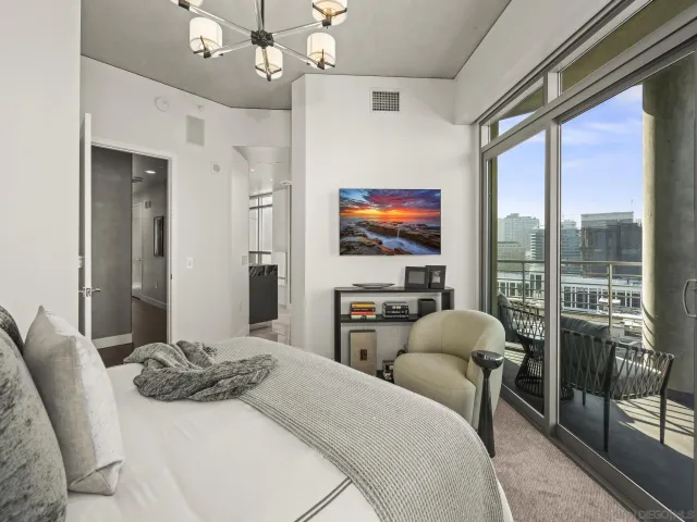 a room with furniture a rug and a window