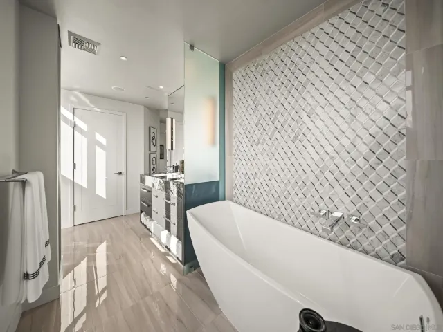 a kitchen with stainless steel appliances granite countertop a sink and stove top oven