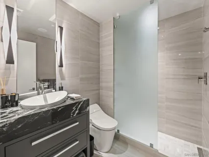 a terrace with outdoor seating city view and barbeque oven