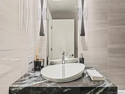 a view of roof deck with seating space and city view