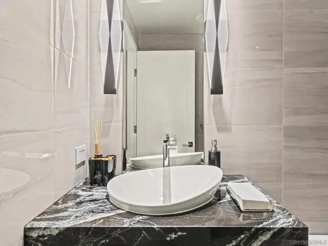 a view of roof deck with seating space and city view