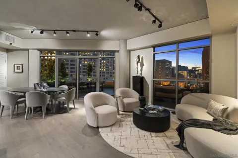 a bedroom with a large bed and a flat screen tv