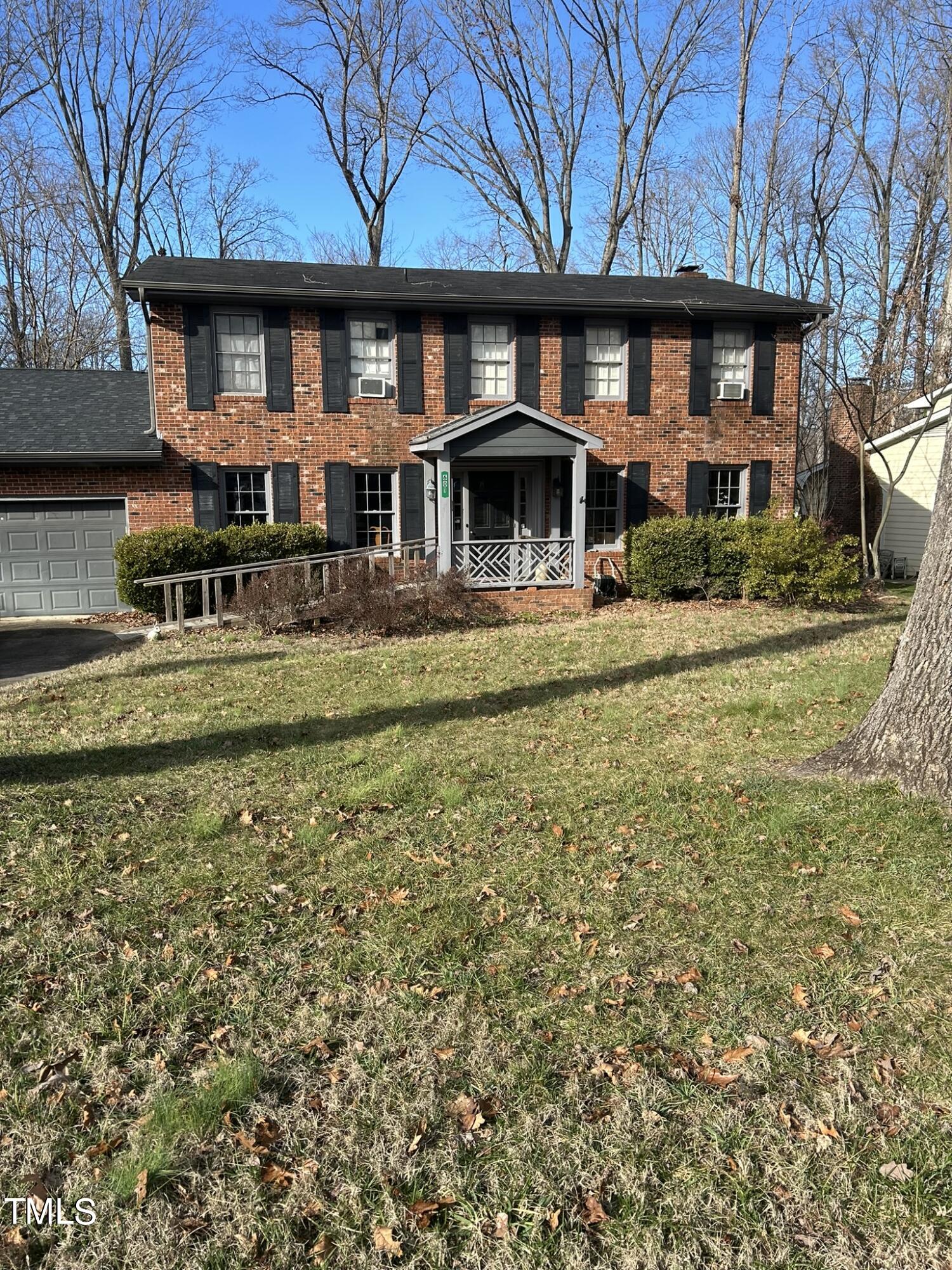 601 Ortega Road Raleigh, NC 27609 - Photo 1 of 36 a front view of a building with a garden