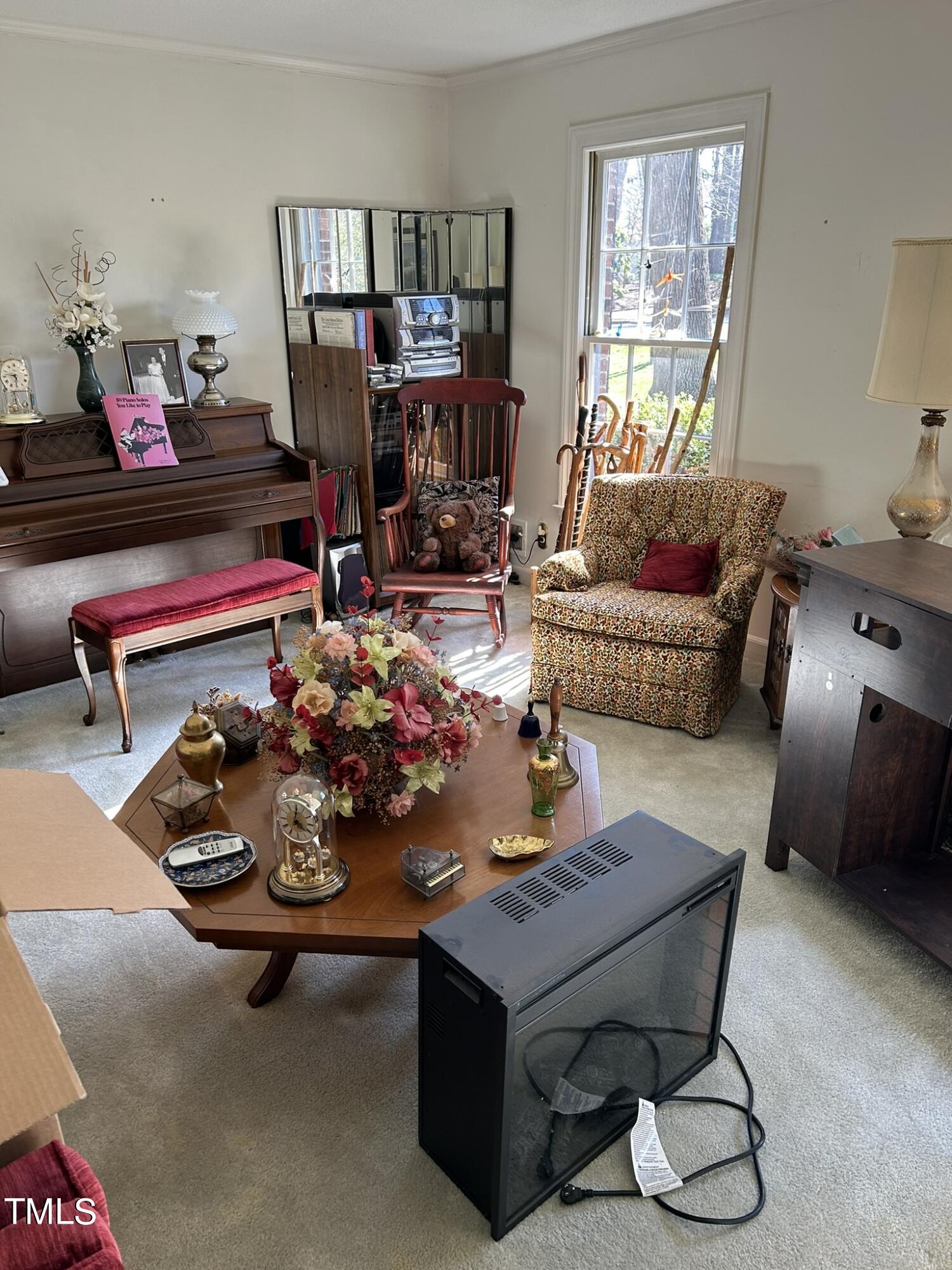 601 Ortega Road Raleigh, NC 27609 - Photo 13 of 36 a living room with furniture and a wooden floor