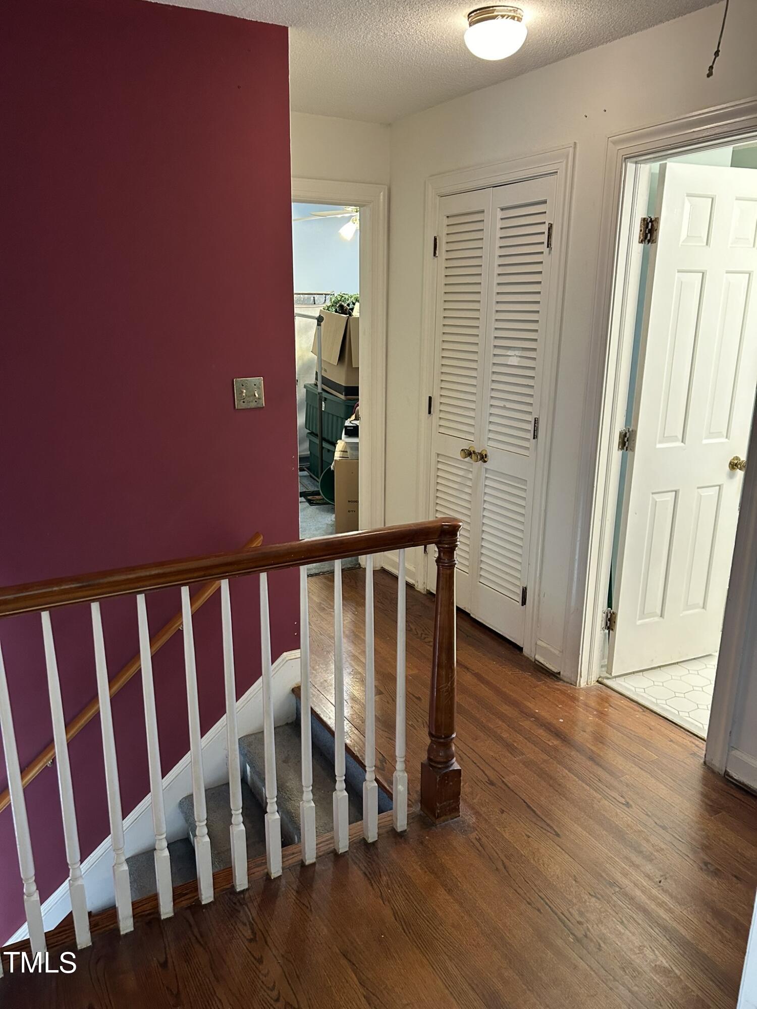 601 Ortega Road Raleigh, NC 27609 - Photo 25 of 36 a view of a hallway with wooden floor and entryway