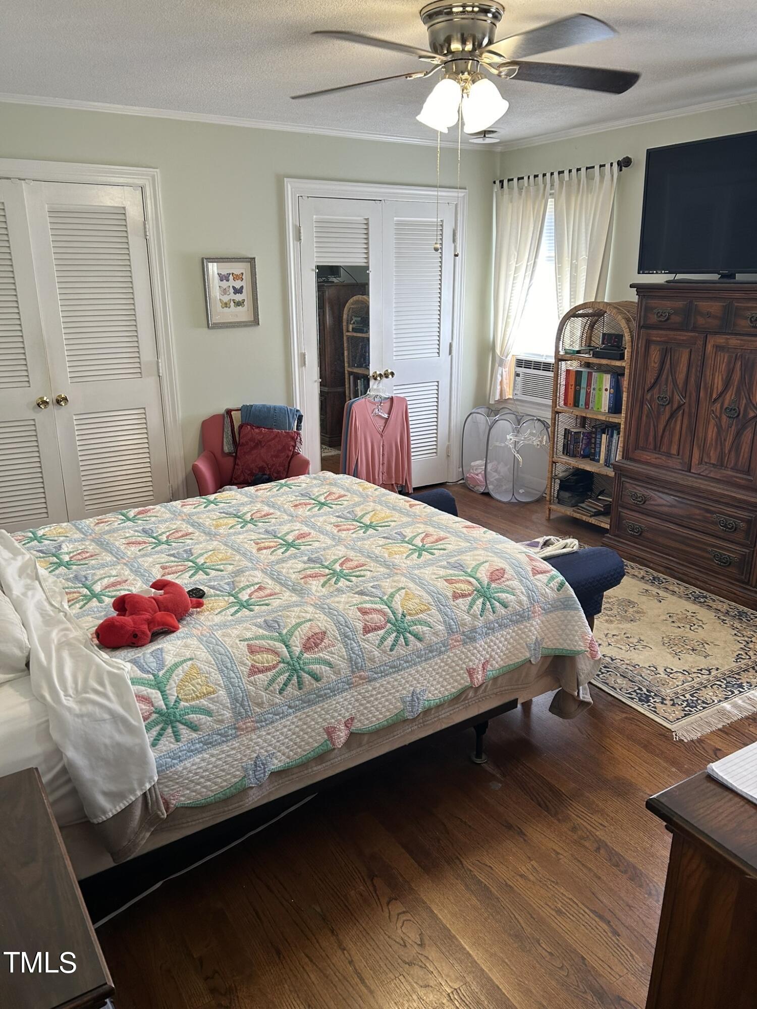 601 Ortega Road Raleigh, NC 27609 - Photo 26 of 36 a bedroom with a bed and a flat screen tv