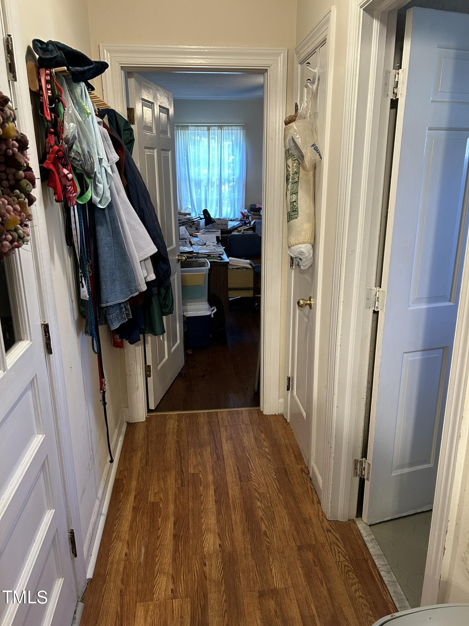 601 Ortega Road Raleigh, NC 27609 - Photo 33 of 36 a view of a hallway with wooden floor and stairs