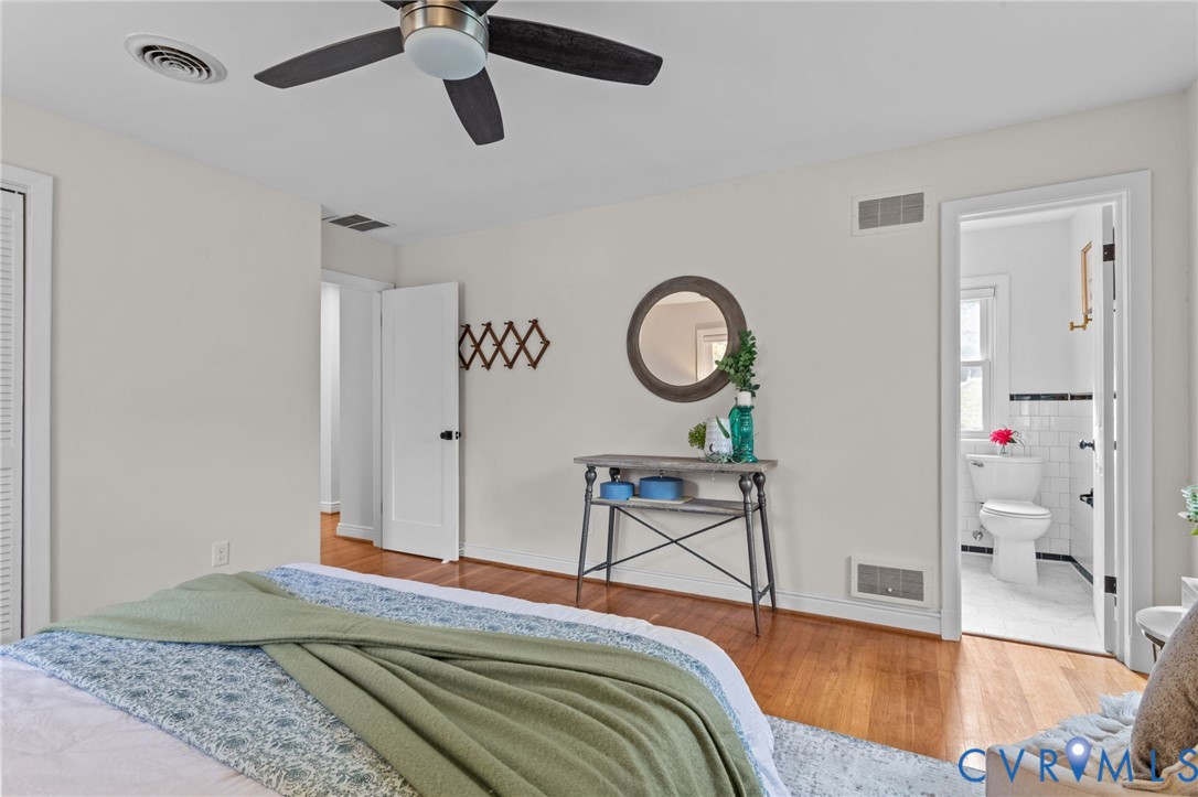 3819 Wakefield Road Richmond, VA 23235 - Photo 21 of 49 a bedroom with a bed chandelier and a window