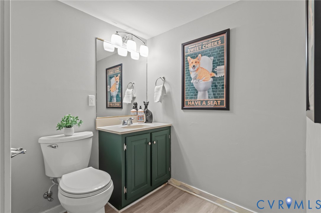 3819 Wakefield Road Richmond, VA 23235 - Photo 35 of 49 a bathroom with a toilet a sink and mirror