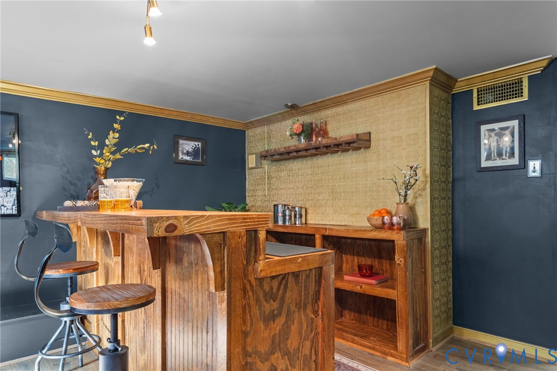 3819 Wakefield Road Richmond, VA 23235 - Photo 39 of 49 a view of a dining room with furniture and chandelier