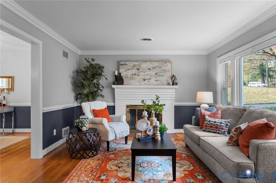 3819 Wakefield Road Richmond, VA 23235 - Photo 3 of 49 a living room with furniture and a fireplace