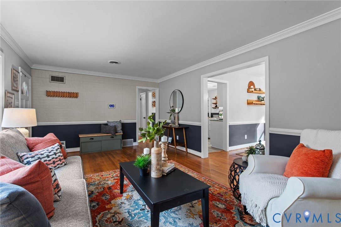 3819 Wakefield Road Richmond, VA 23235 - Photo 6 of 49 a living room with furniture and wooden floor