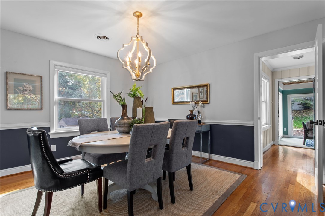 3819 Wakefield Road Richmond, VA 23235 - Photo 8 of 49 a view of a dining room with furniture wooden floor and chandelier