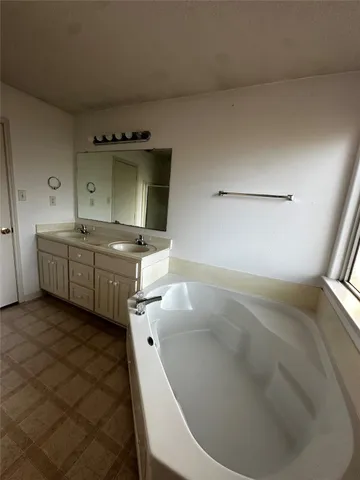 a view of a pathway both side of house