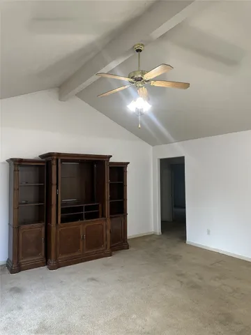 a view of an empty room with a fireplace