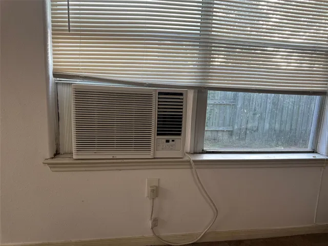 a view of a livingroom with furniture and a fireplace