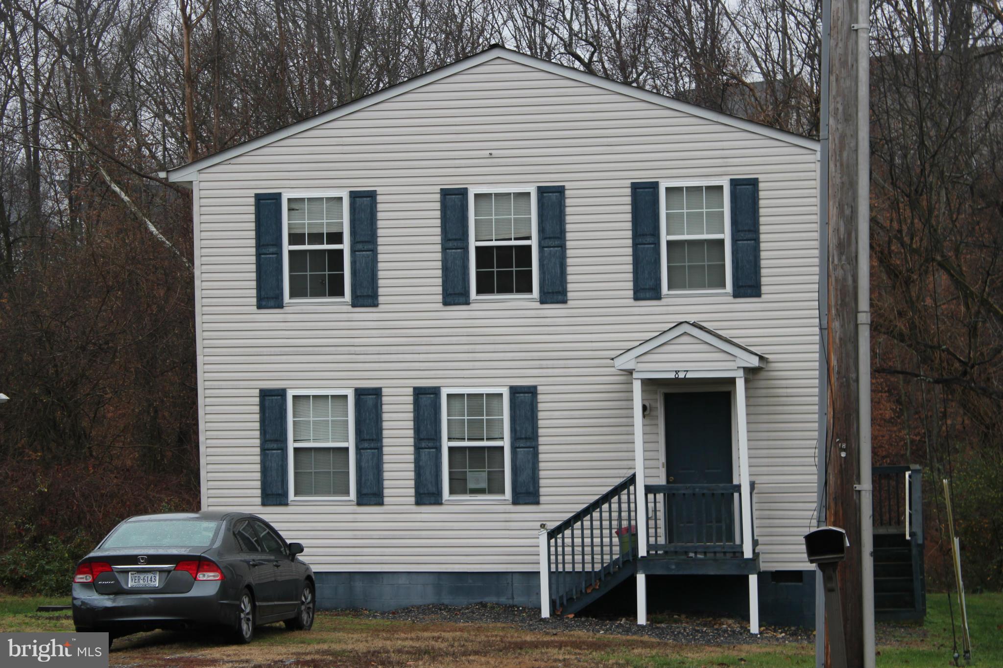 87 Truslow Road Fredericksburg, VA 22405 - Photo 1 of 11 a car parked in front of a house