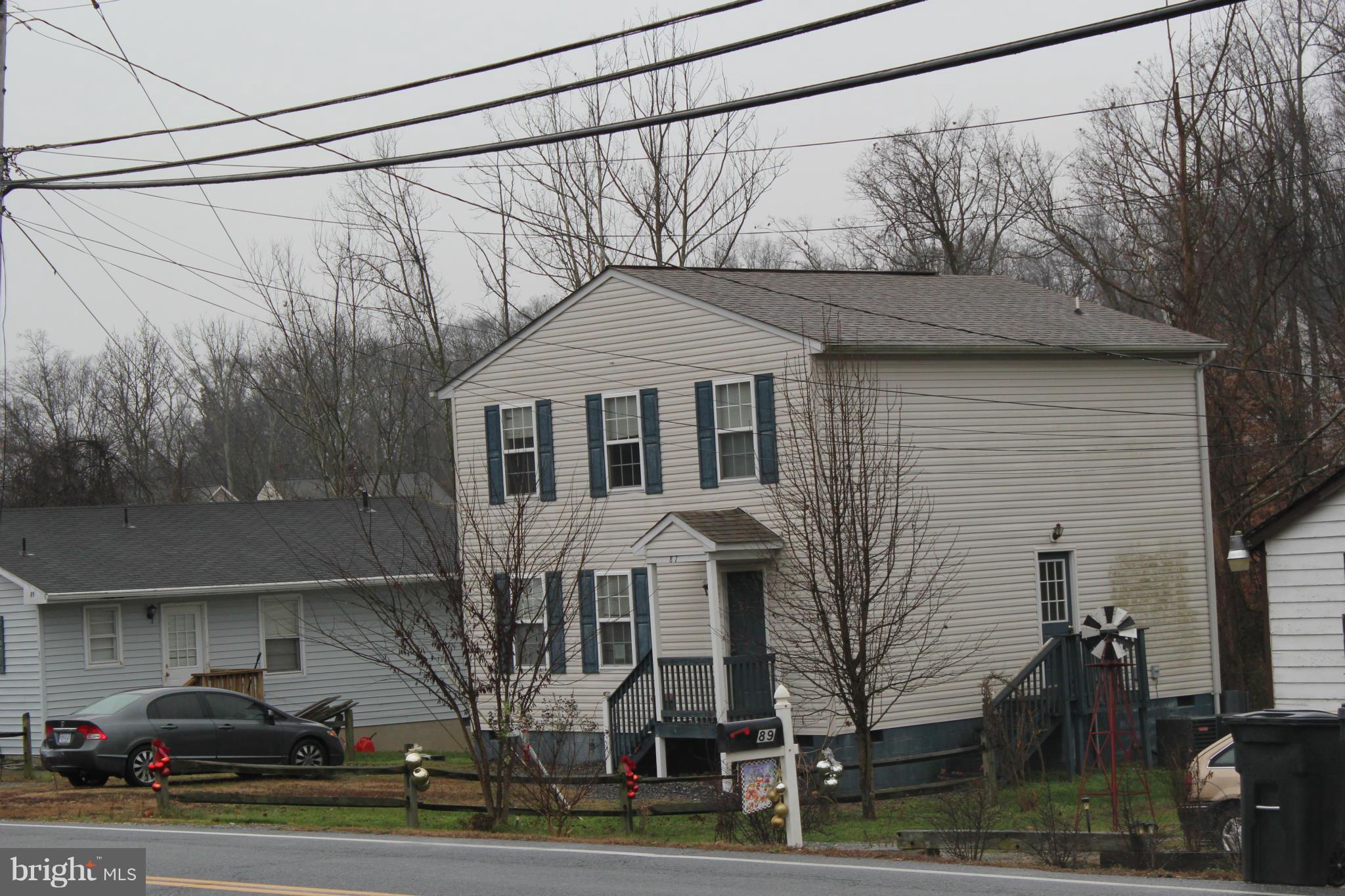 87 Truslow Road Fredericksburg, VA 22405 - Photo 3 of 11 a front view of a house with garden