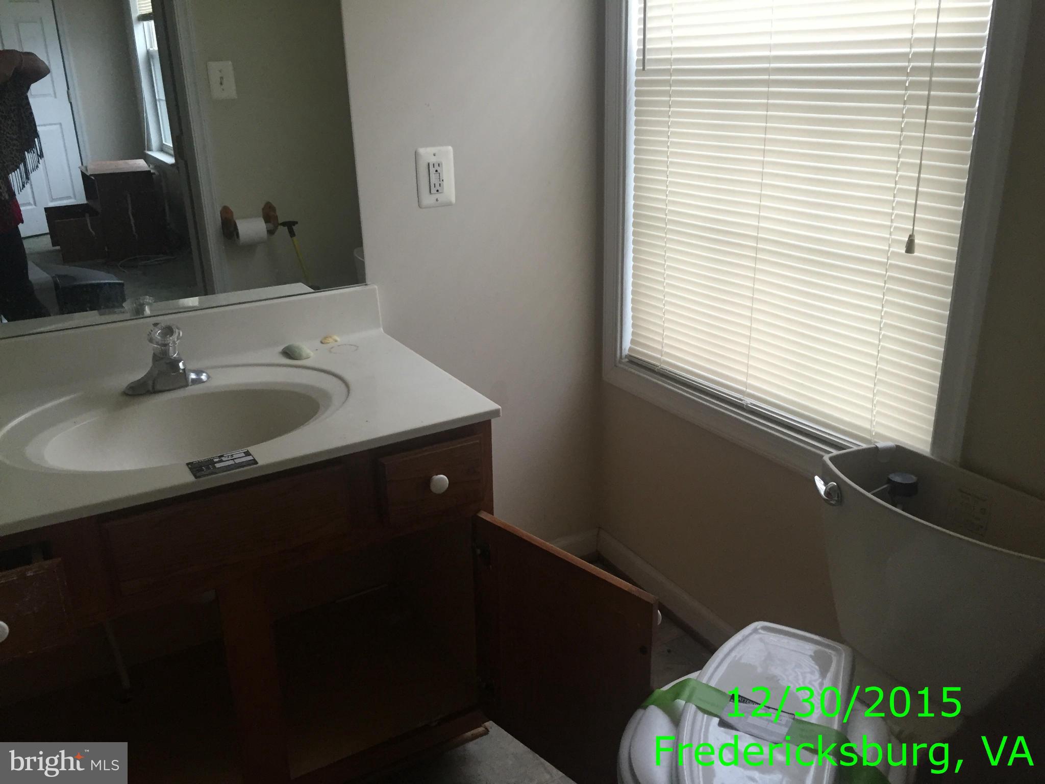 87 Truslow Road Fredericksburg, VA 22405 - Photo 10 of 11 a bathroom with a sink and a mirror