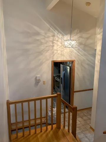 a kitchen with stainless steel appliances granite countertop a refrigerator and a stove