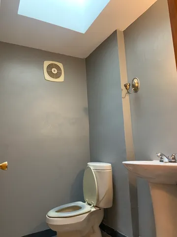 a kitchen with granite countertop a sink cabinets and stainless steel appliances