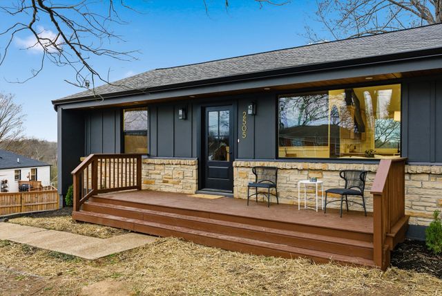 a view of a living room and balcony