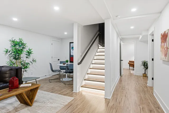 a bedroom with a bed and a bookshelf