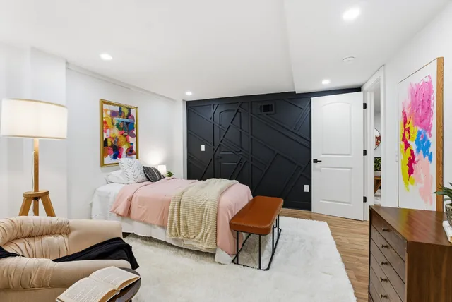 a bedroom with double bed and a window