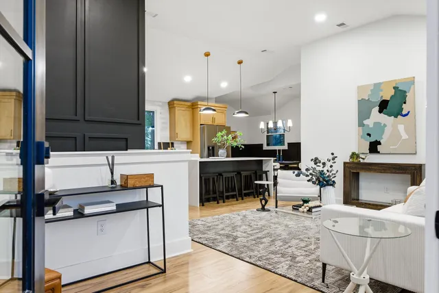 a view of kitchen with furniture and wooden floor