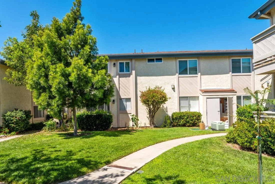 11187 Kelowna Road, Unit 74 San Diego, CA 92126 - Photo 1 of 24 a front view of a house with a yard
