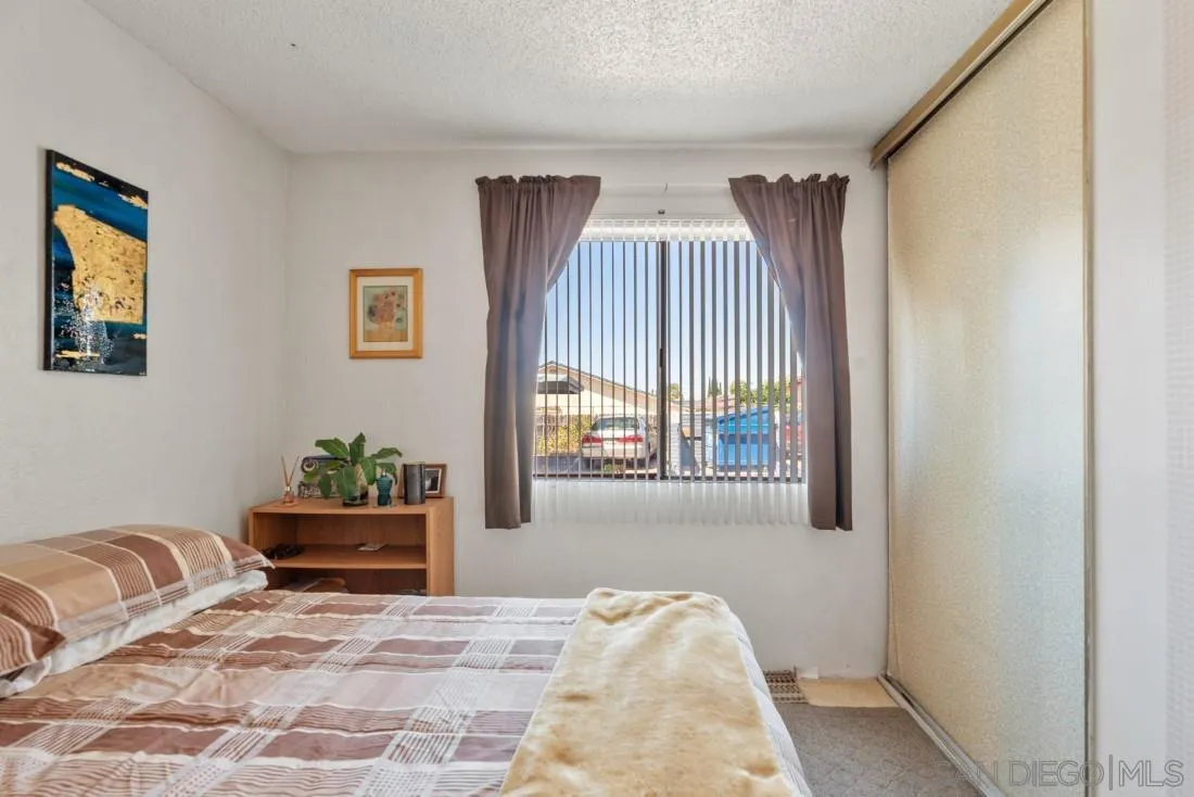 11187 Kelowna Road, Unit 74 San Diego, CA 92126 - Photo 12 of 24 a view of livingroom with furniture and window