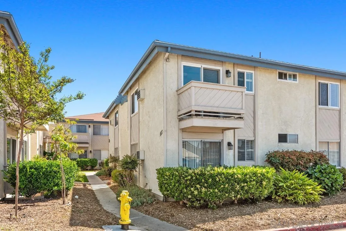 11187 Kelowna Road, Unit 74 San Diego, CA 92126 - Photo 21 of 24 a front view of a house with a yard