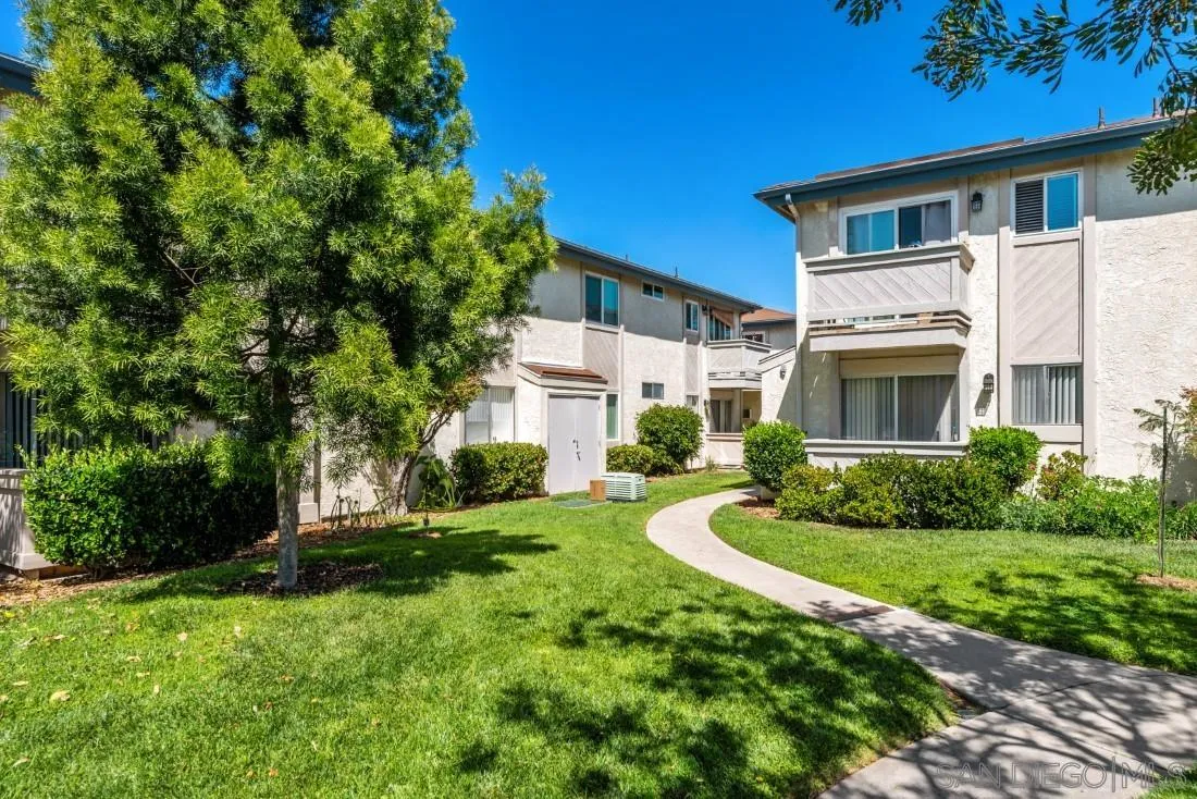 11187 Kelowna Road, Unit 74 San Diego, CA 92126 - Photo 23 of 24 a front view of a house with a yard