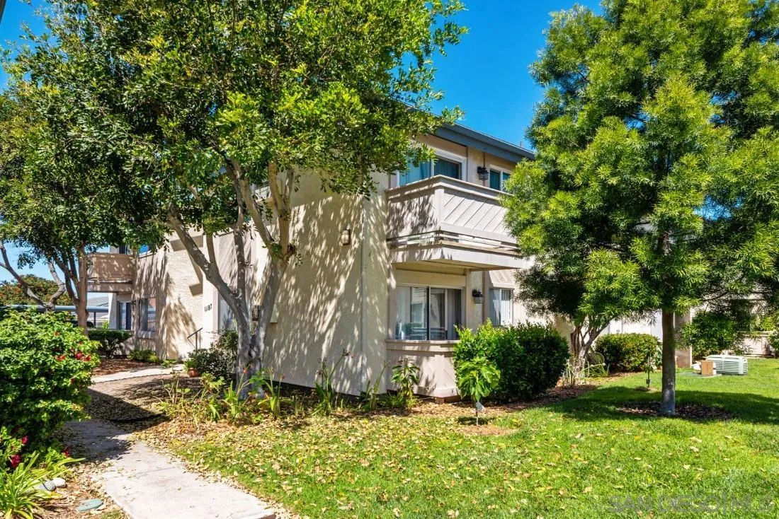 11187 Kelowna Road, Unit 74 San Diego, CA 92126 - Photo 3 of 24 a front view of a house with a yard