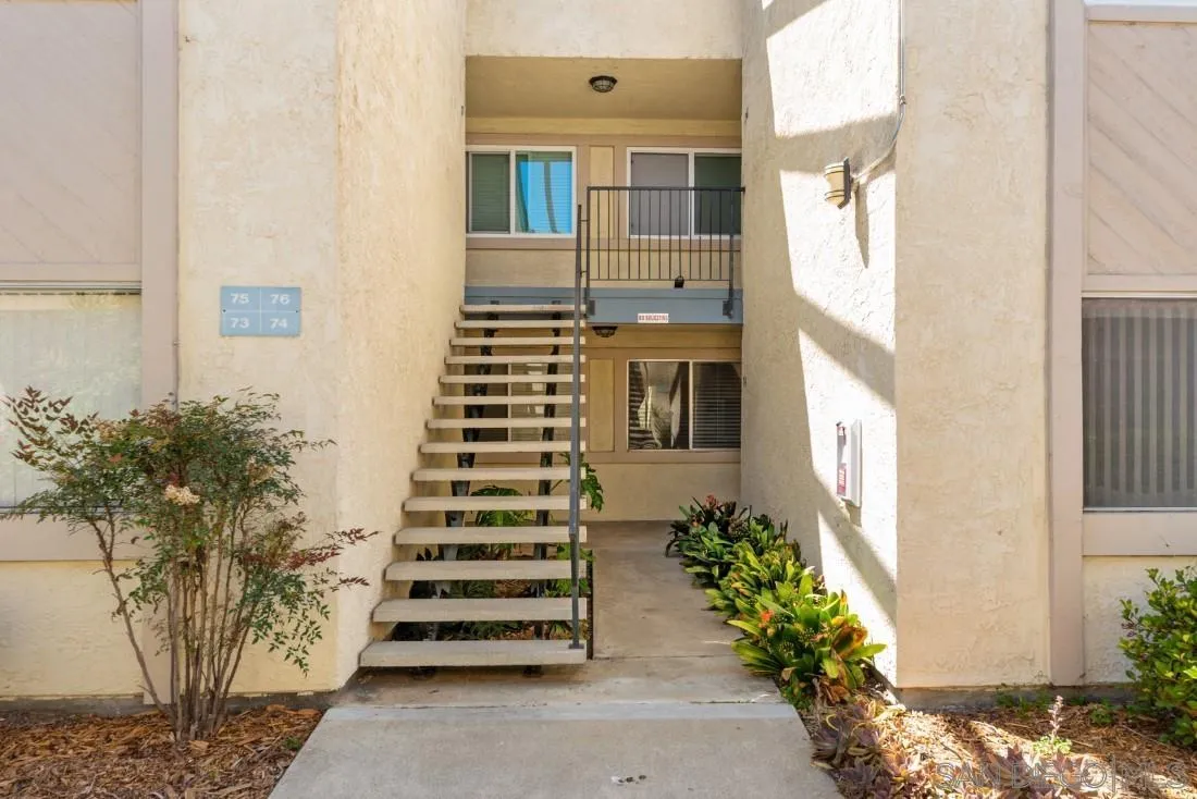 11187 Kelowna Road, Unit 74 San Diego, CA 92126 - Photo 4 of 24 a view of a house with a yard