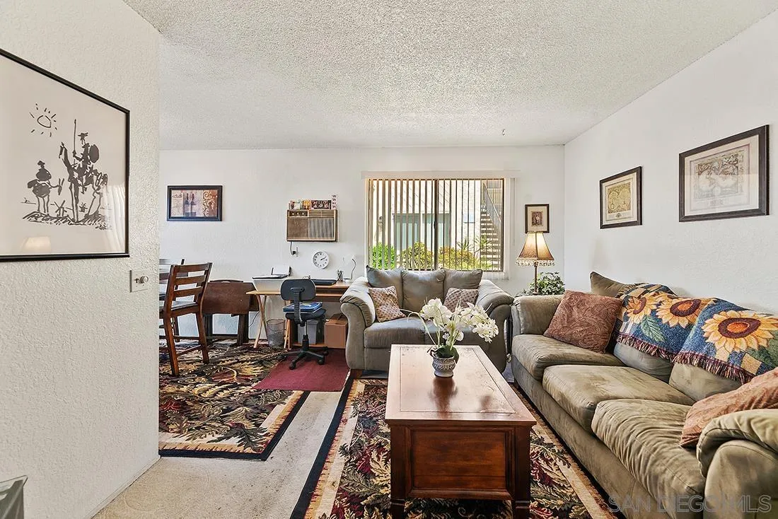 11187 Kelowna Road, Unit 74 San Diego, CA 92126 - Photo 5 of 24 a living room with furniture two couch and a window