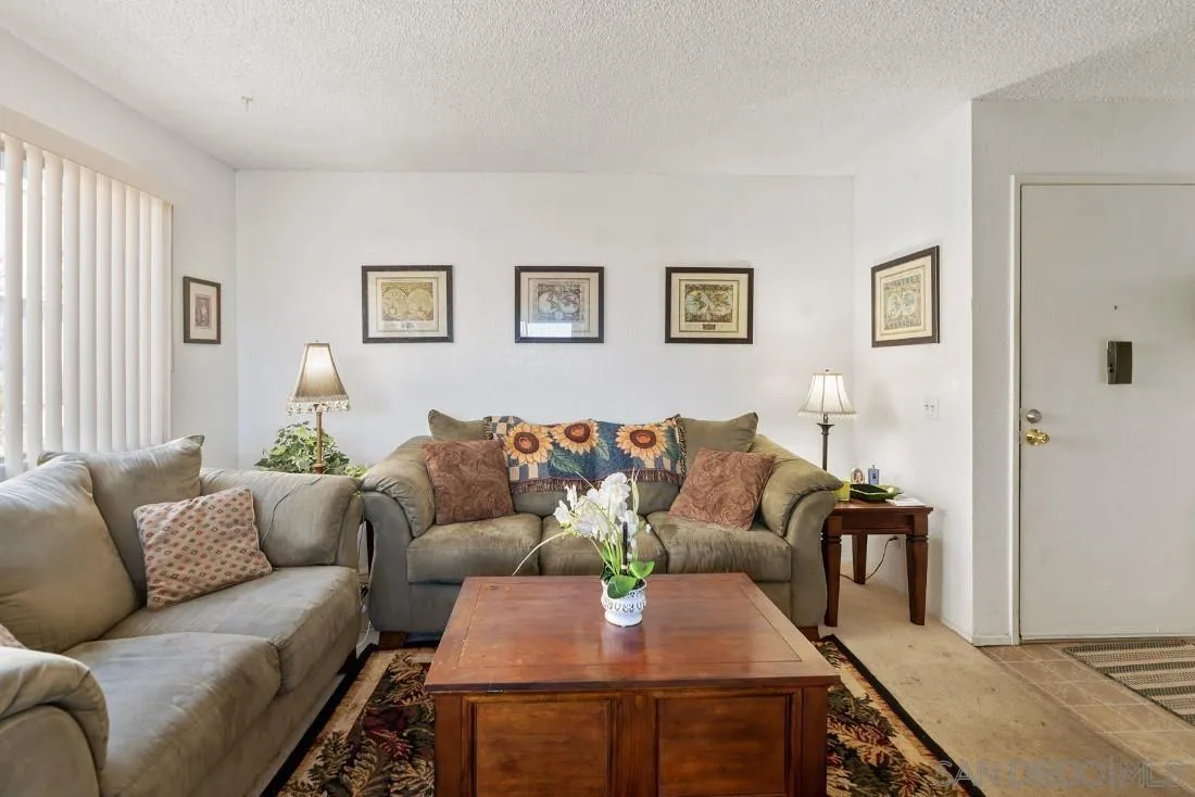 11187 Kelowna Road, Unit 74 San Diego, CA 92126 - Photo 6 of 24 a living room with furniture and a couch