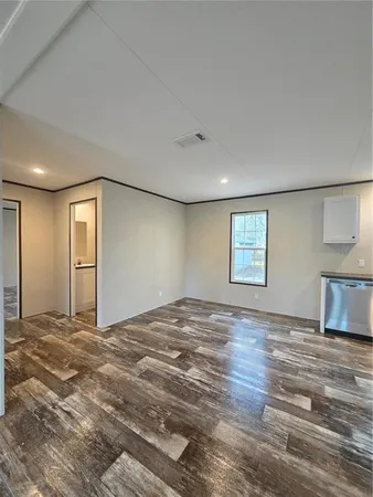 a bathroom with a sink toilet a mirror and shower