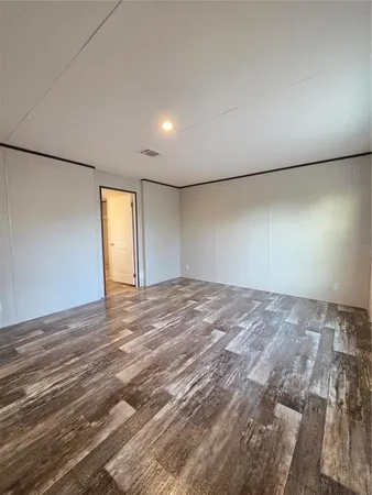 a view of a field with trees