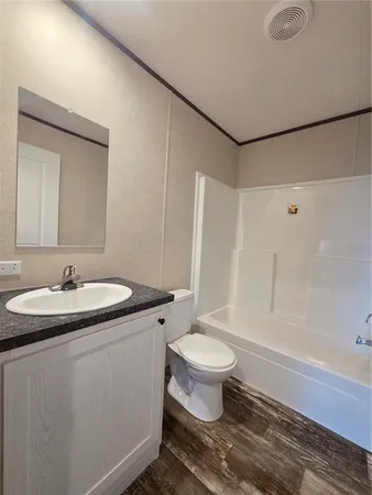 a view of an entryway with wooden floor