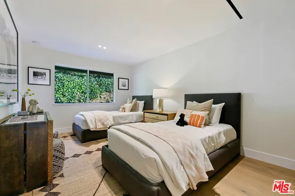 a bedroom with a bed and a table