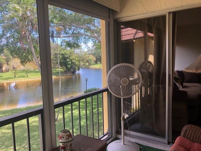 818 Southwest 9th St Circle, Unit 201 Boca Raton, FL 33486 - Photo 13 of 21 Screen porch