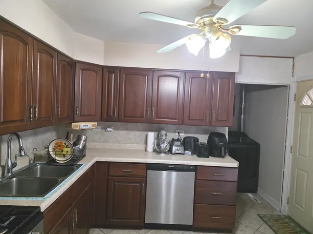 a kitchen with a sink and a stove