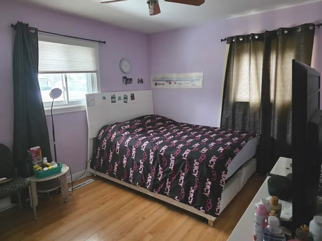 a bedroom with a bed and window