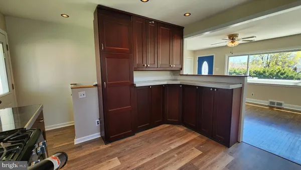 a kitchen with wooden cabinets and a sink