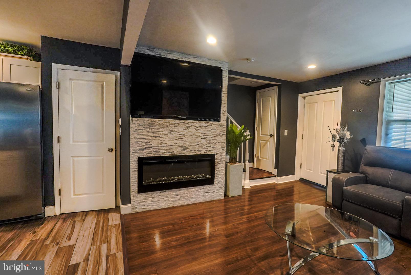 3915 Flowerton Road Baltimore, MD 21229 - Photo 3 of 17 a living room with furniture and a fireplace