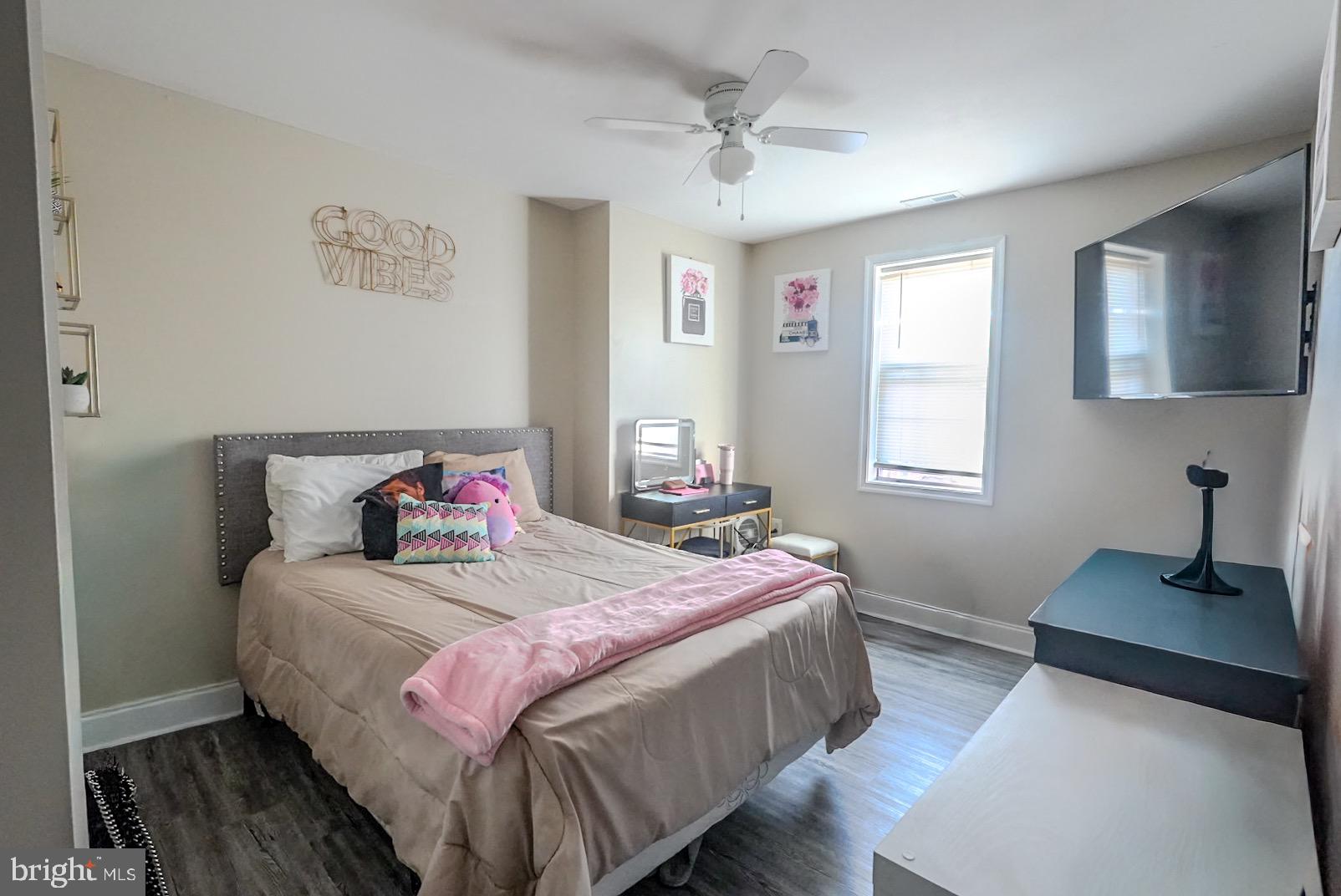 3915 Flowerton Road Baltimore, MD 21229 - Photo 8 of 17 a bedroom with a bed and a window