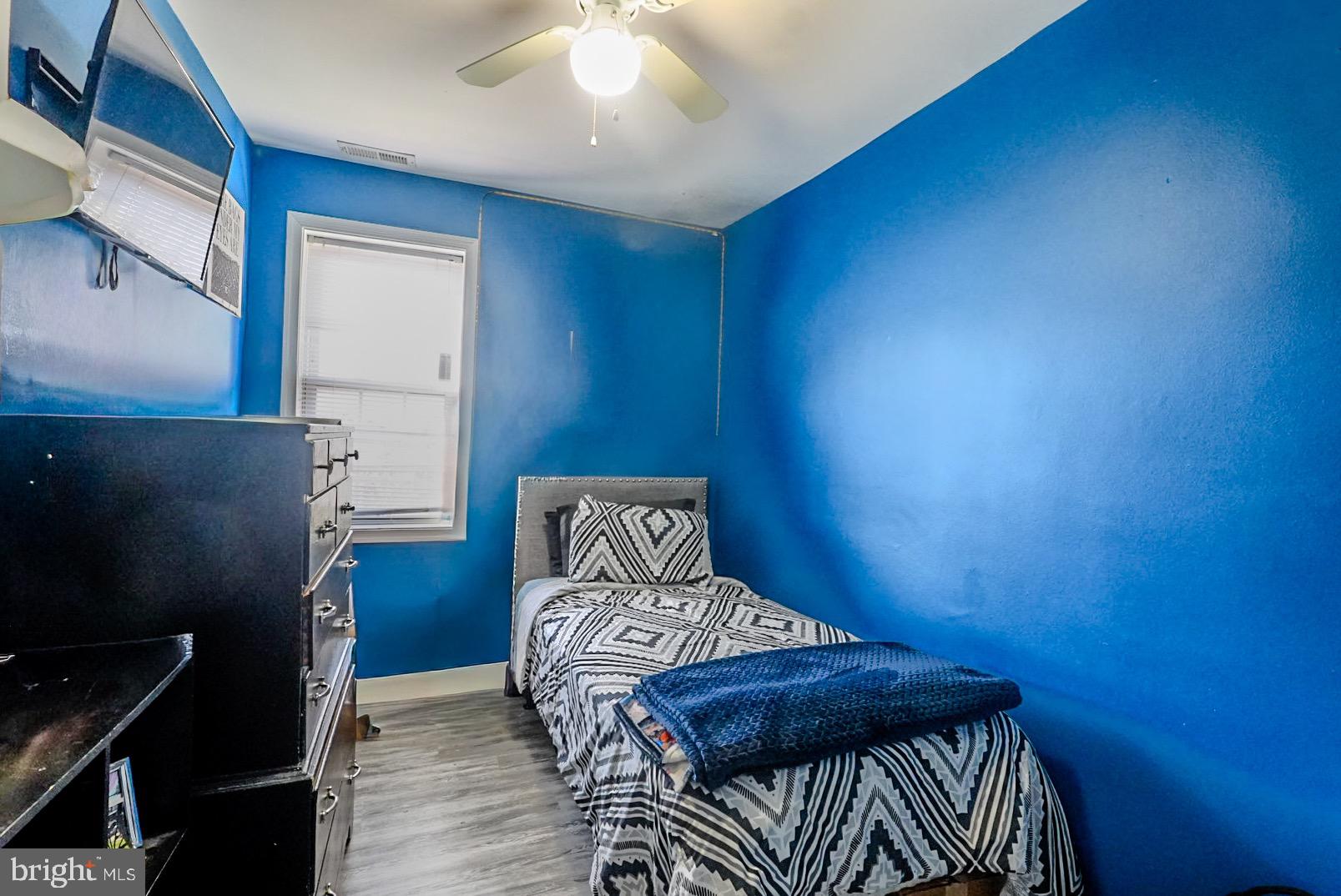 3915 Flowerton Road Baltimore, MD 21229 - Photo 9 of 17 a bedroom with a bed and a window