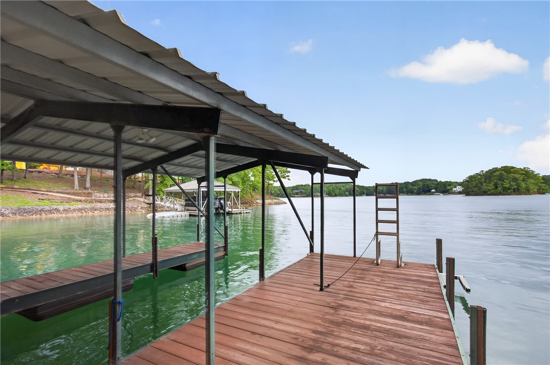 304 Lakeside Drive Seneca, SC 29672 - Photo 47 of 50 Boating enthusiasts will adore this waterfront property featuring a covered dock and immediate lake access.